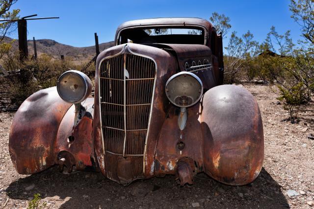 A rusty vehicle from the 1930s.
