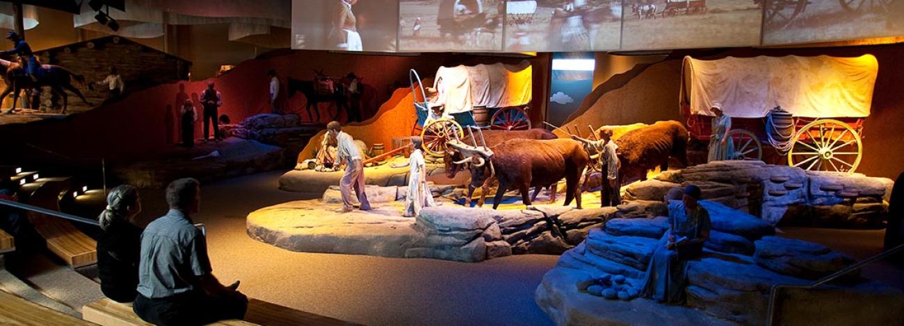 Visitors watch a welcome video in the theater of the National Historic Trails Interpretive Center